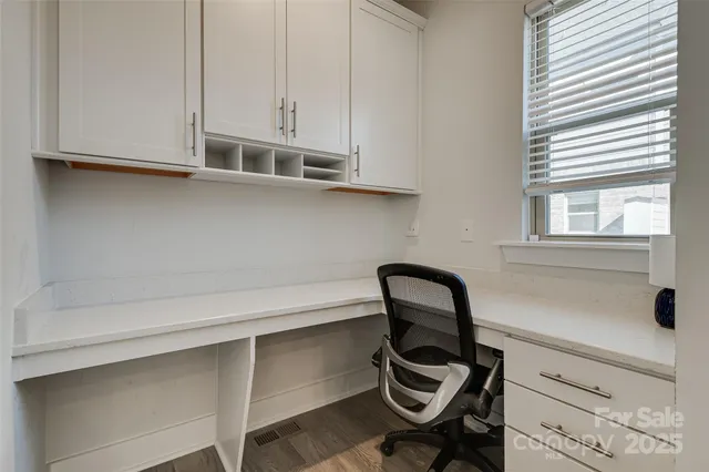 a view of a living room and hardwood floor