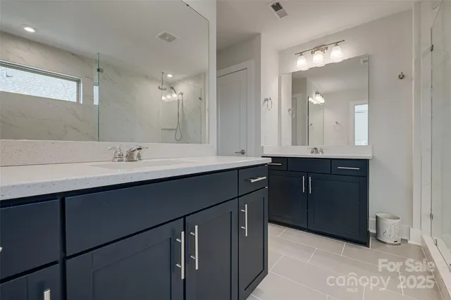 a view of walk in closet with clothes