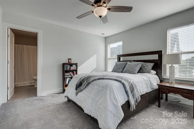 a bedroom with a bed and a chair