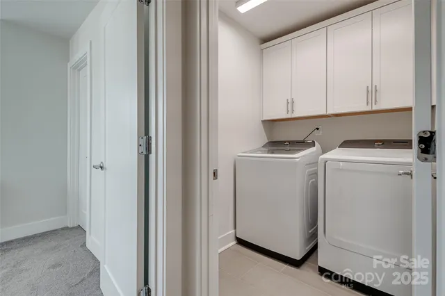 a bedroom with a bed and painting on the wall