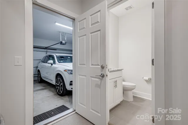 a room with gym equipment and view of living room