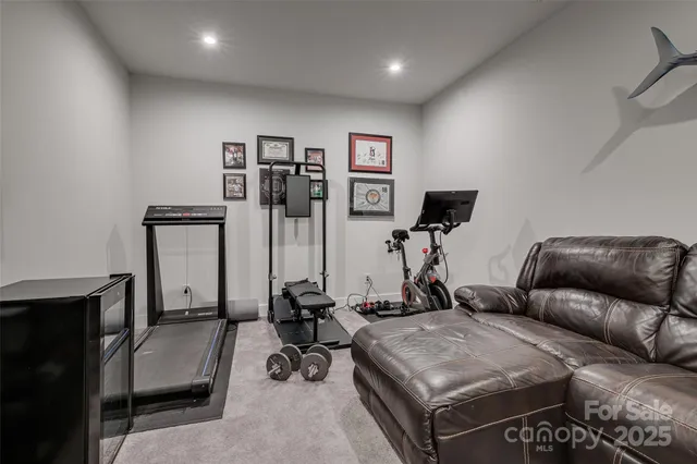 a bedroom with furniture and flat screen tv