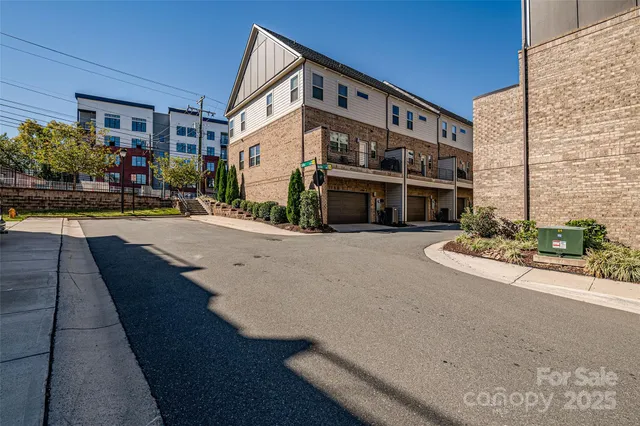 a building with a table and chairs in front of it