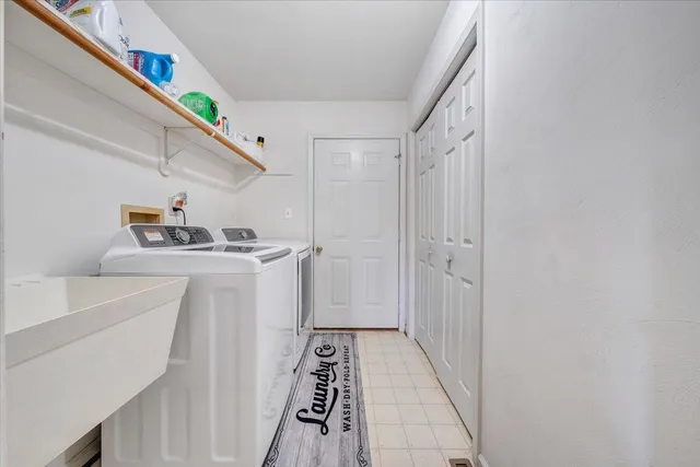 a hallway with washer and dryer