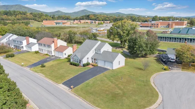 an aerial view of a house with pool