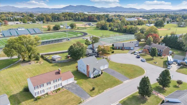 a view of a lake with couches and city view