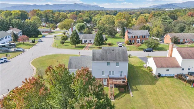 an aerial view of a house with a swimming pool