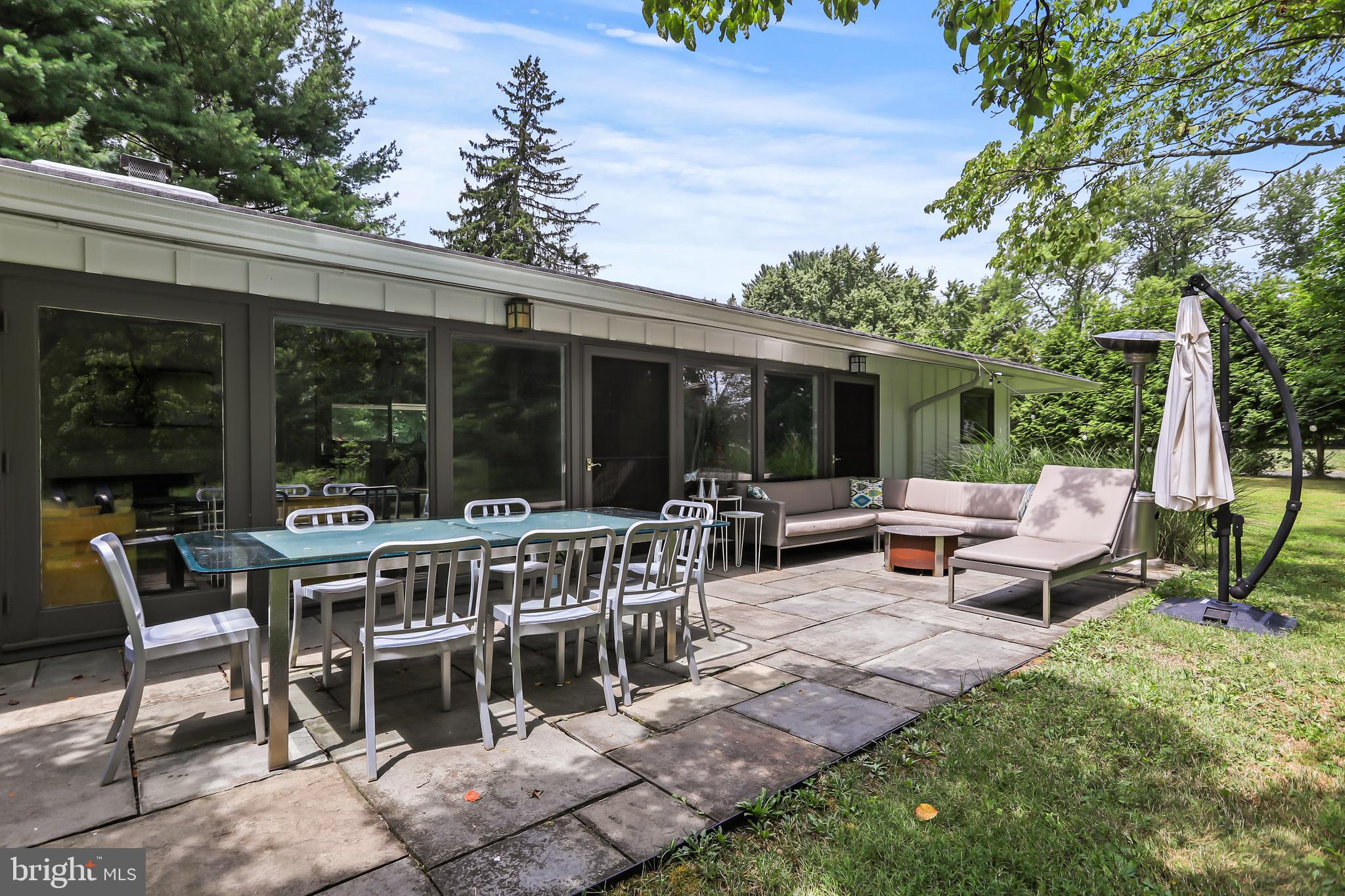 1004 Mercer Road Princeton, NJ 08540 - Photo 24 of 28 a view of a patio with a table chairs and a backyard