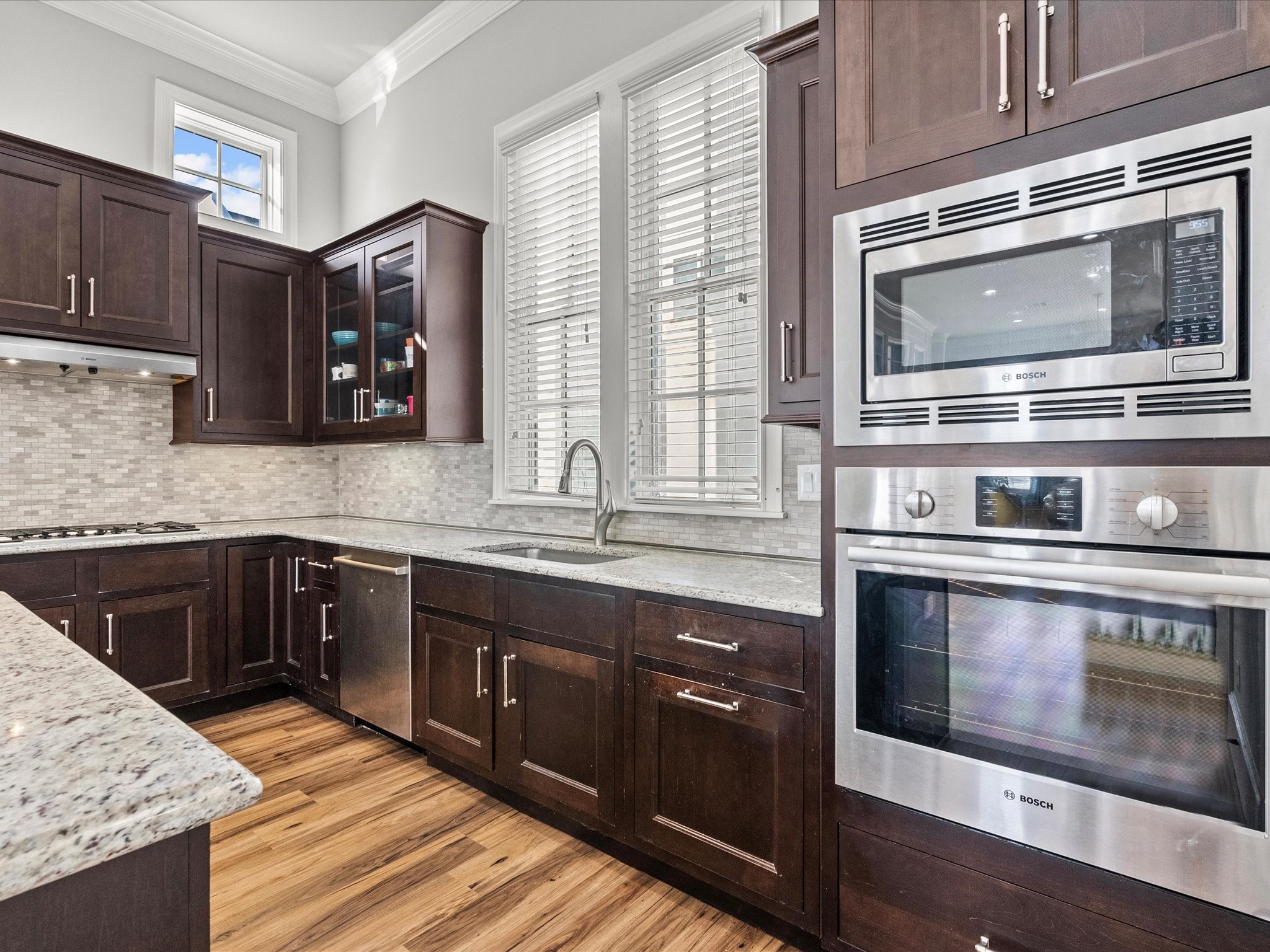 5616 Cohn Terrace Houston, TX 77007 - Photo 12 of 33 a kitchen with stainless steel appliances granite countertop a stove and a sink