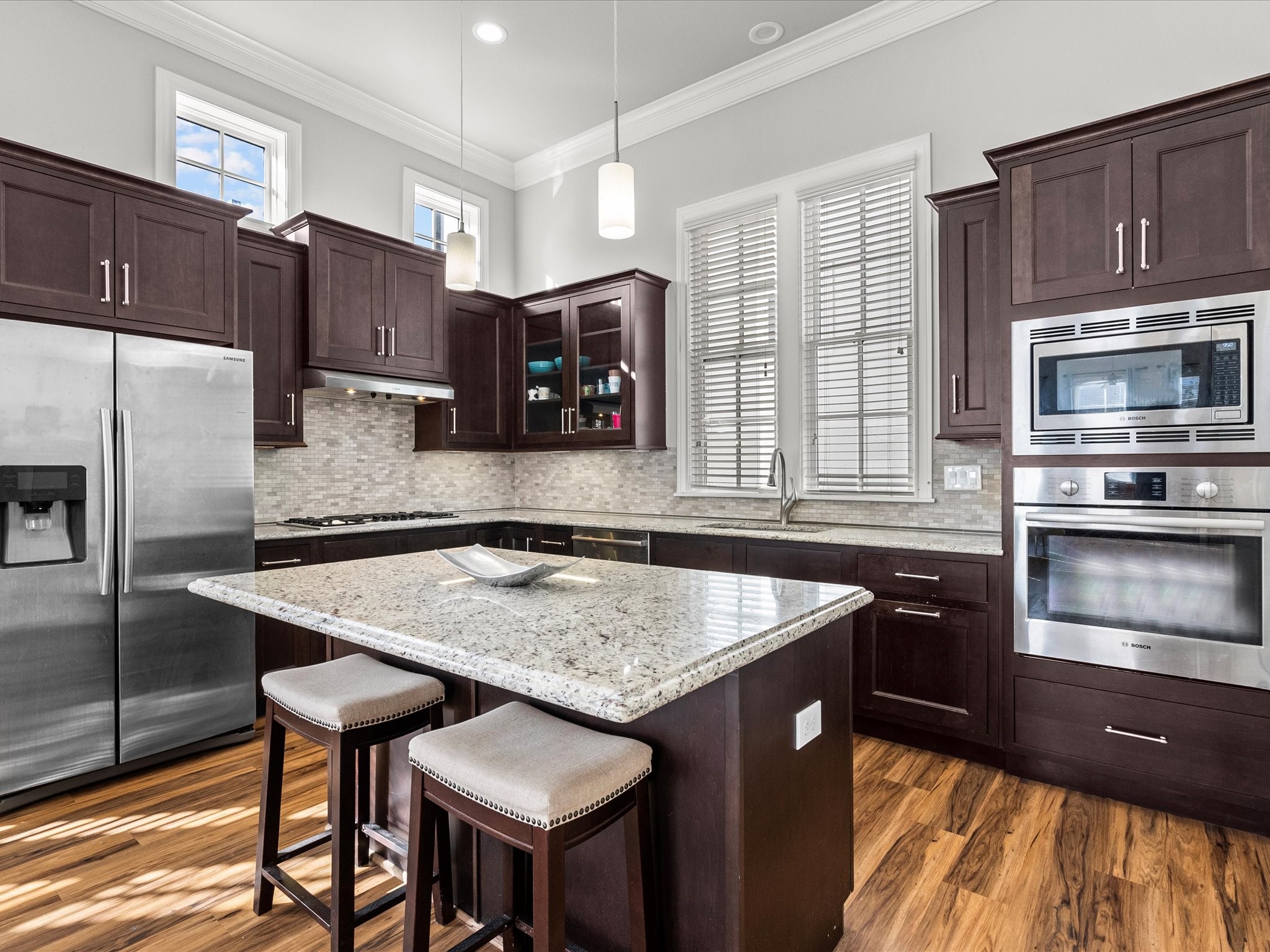 5616 Cohn Terrace Houston, TX 77007 - Photo 15 of 33 a kitchen with stainless steel appliances granite countertop a kitchen island a stove and a refrigerator