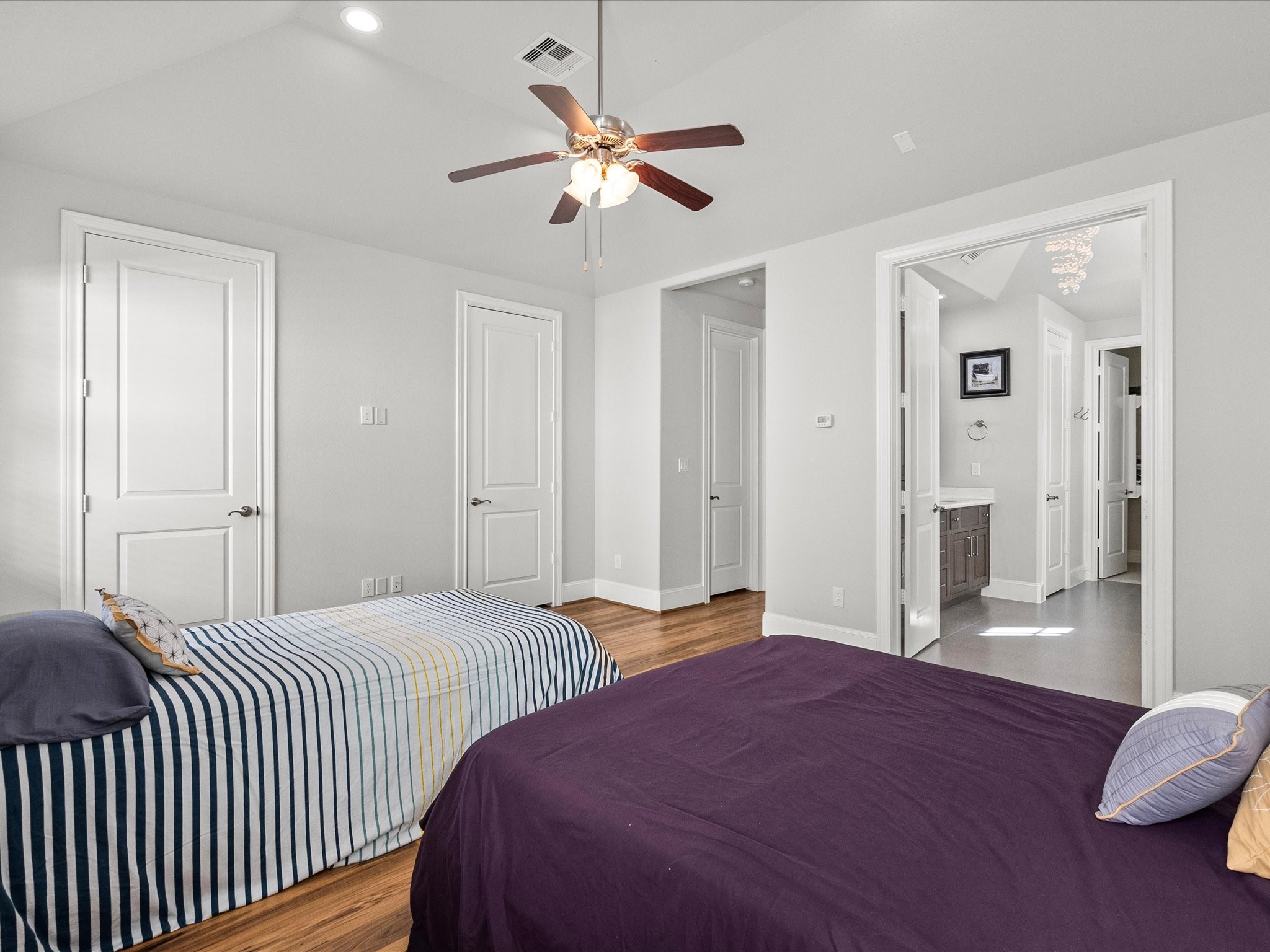 5616 Cohn Terrace Houston, TX 77007 - Photo 17 of 33 a bedroom with bed and a chandelier