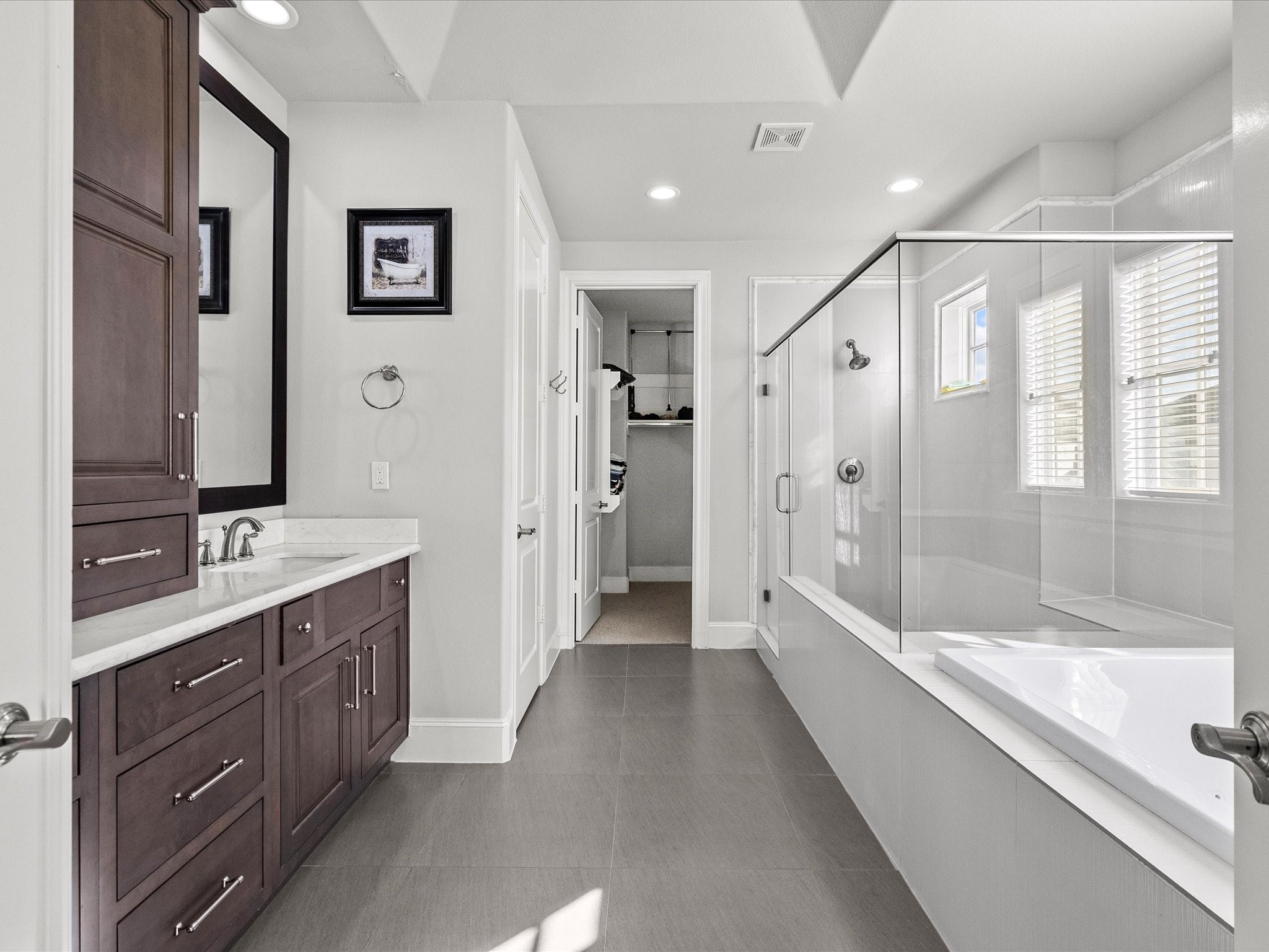 5616 Cohn Terrace Houston, TX 77007 - Photo 20 of 33 a bathroom with a bathtub shower and sink