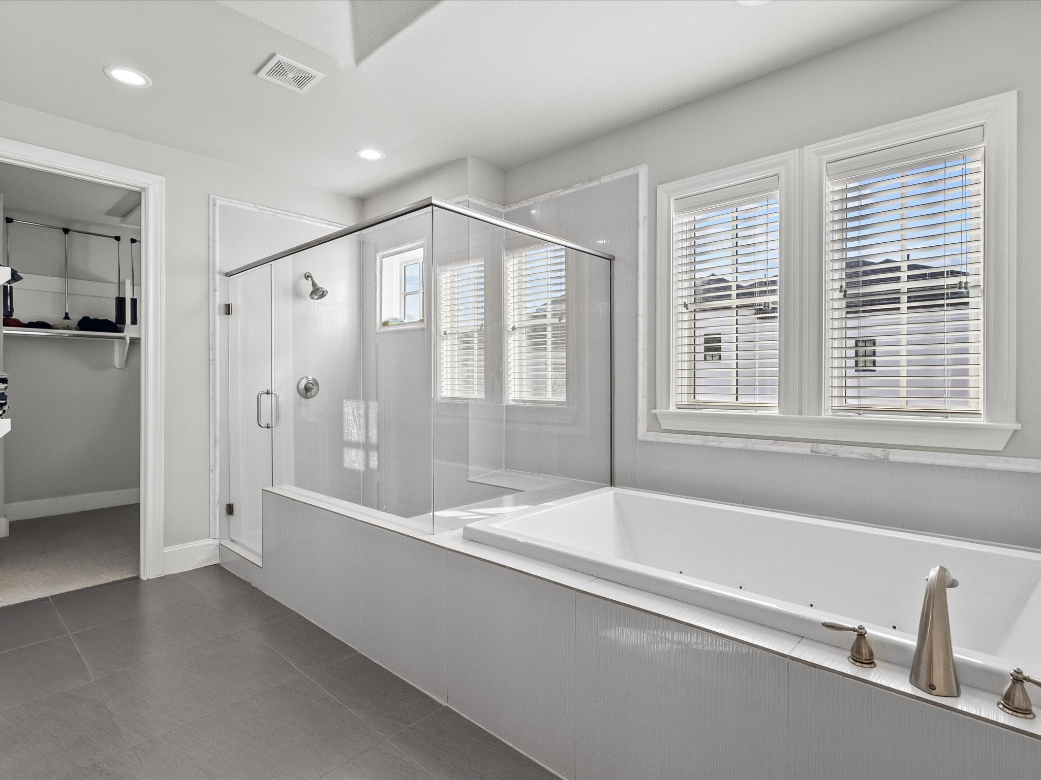 5616 Cohn Terrace Houston, TX 77007 - Photo 21 of 33 a spacious bathroom with a bathtub and a shower