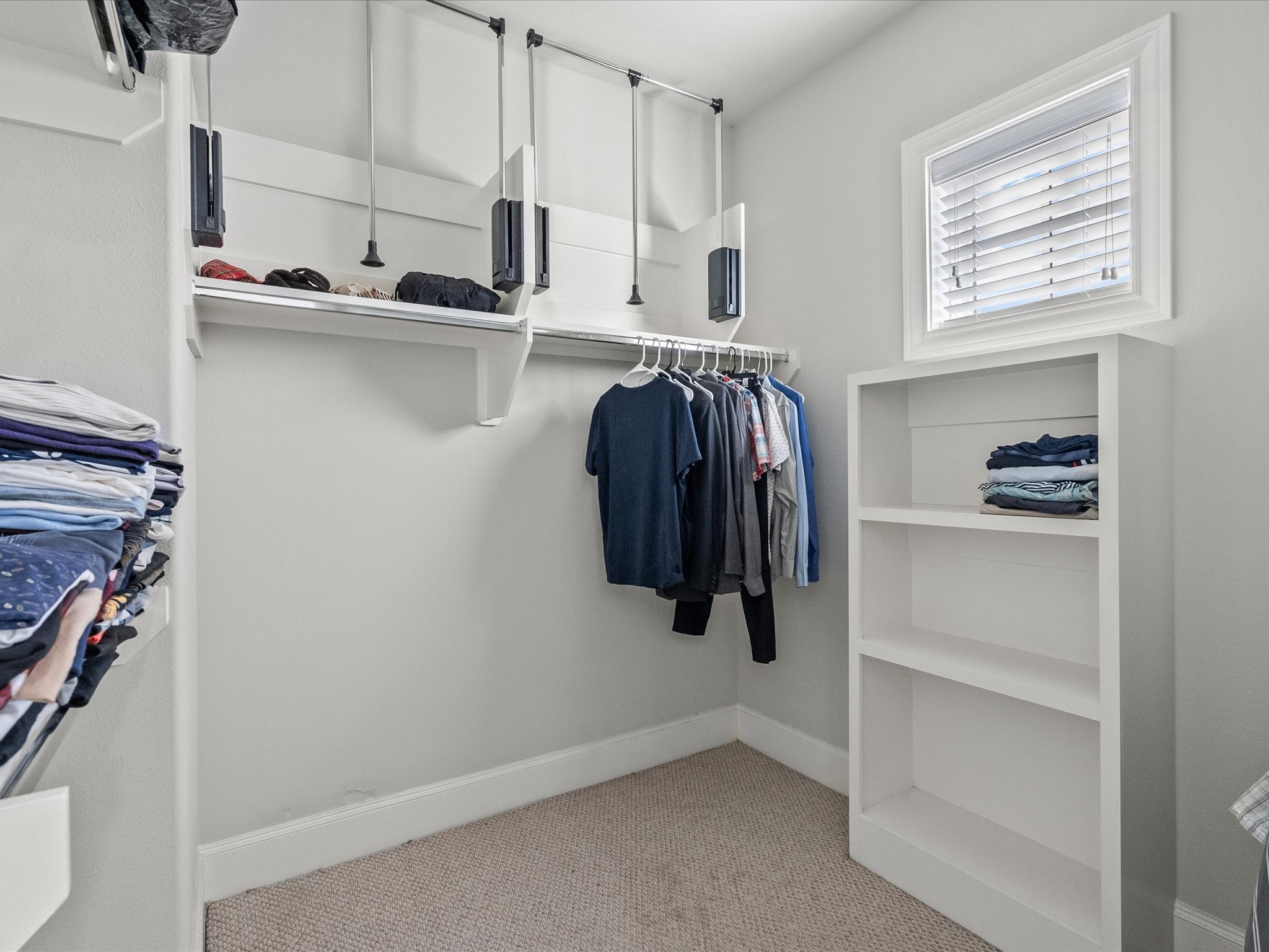 5616 Cohn Terrace Houston, TX 77007 - Photo 22 of 33 a view of walk in closet with clothes and shoes