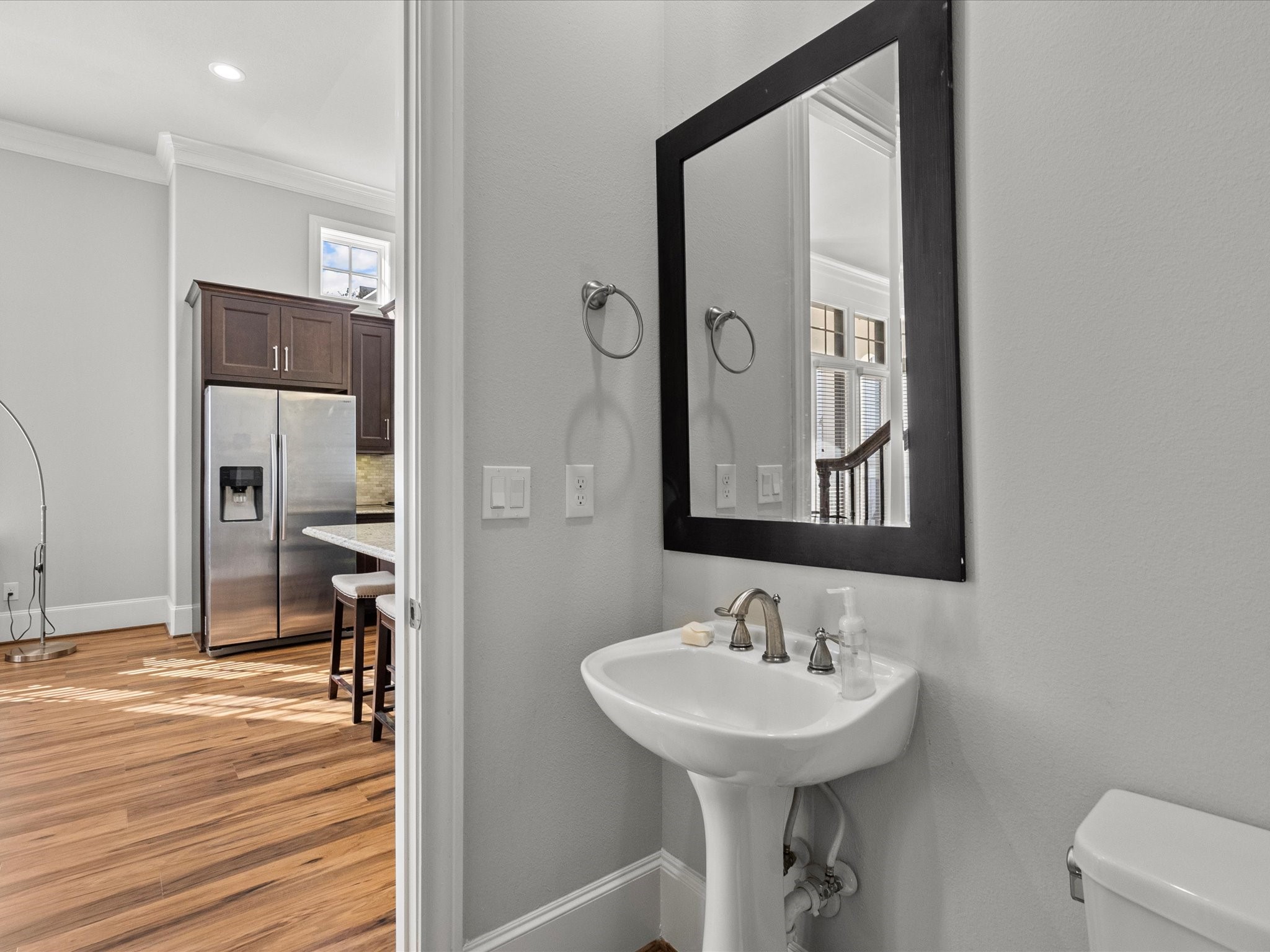 5616 Cohn Terrace Houston, TX 77007 - Photo 28 of 33 a bathroom with a sink a mirror and a shower
