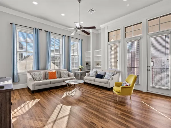 a living room with stainless steel appliances kitchen island granite countertop furniture and a kitchen view
