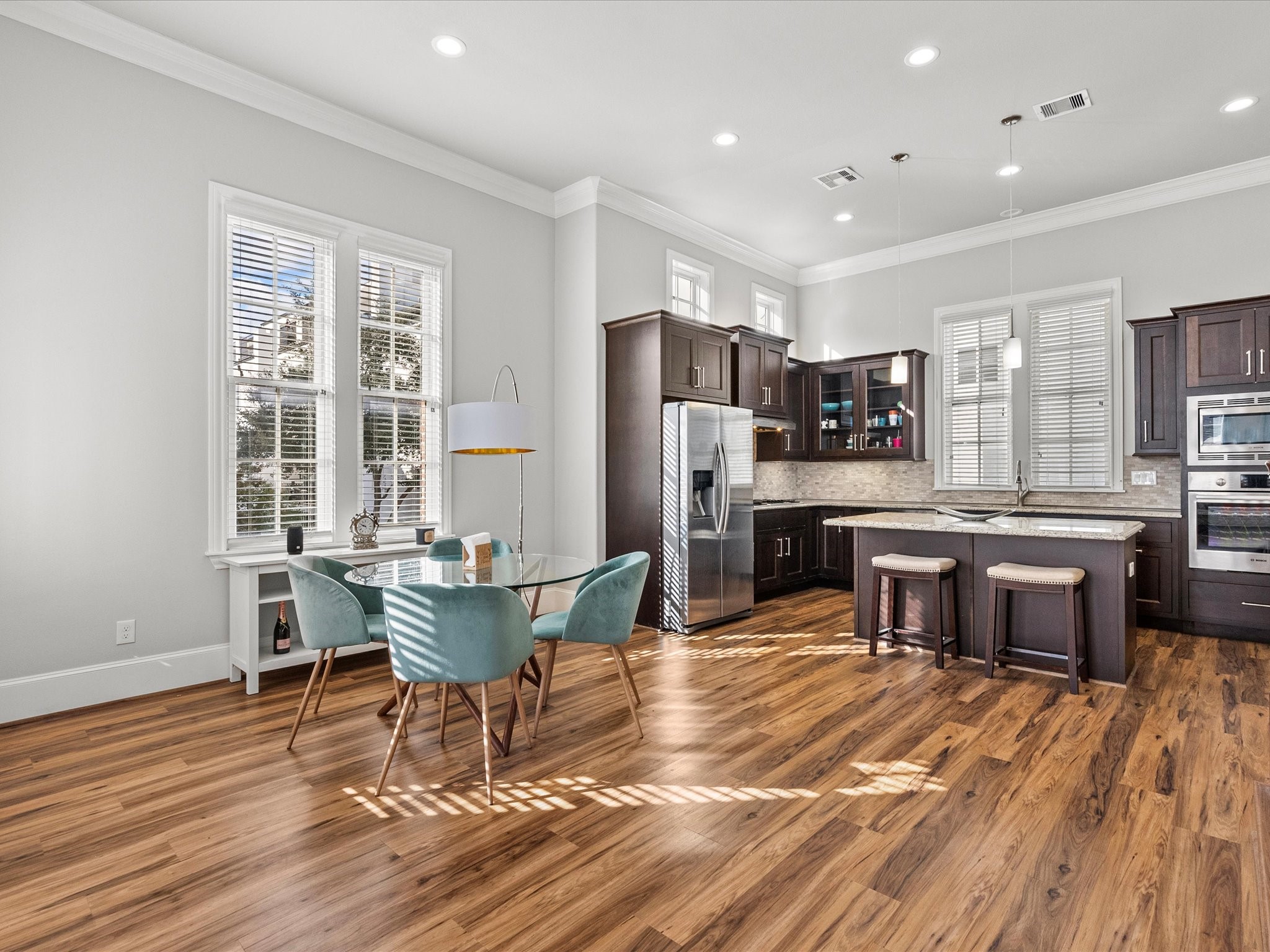 5616 Cohn Terrace Houston, TX 77007 - Photo 5 of 33 a living room with stainless steel appliances kitchen island granite countertop furniture and a kitchen view
