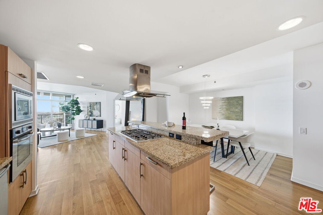 13650 Marina Pointe Drive, Unit 1603 Marina del Rey, CA 90292 - Photo 13 of 75 a kitchen with stainless steel appliances granite countertop a stove and a refrigerator