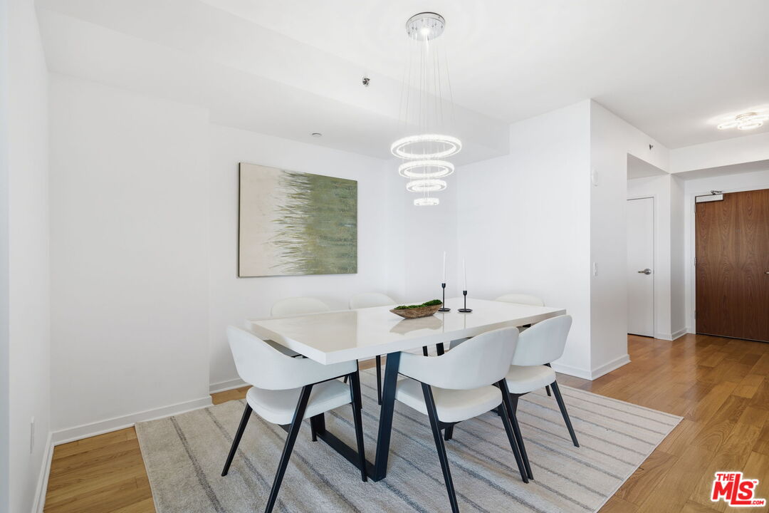 13650 Marina Pointe Drive, Unit 1603 Marina del Rey, CA 90292 - Photo 18 of 75 a view of a dining room with furniture and wooden floor