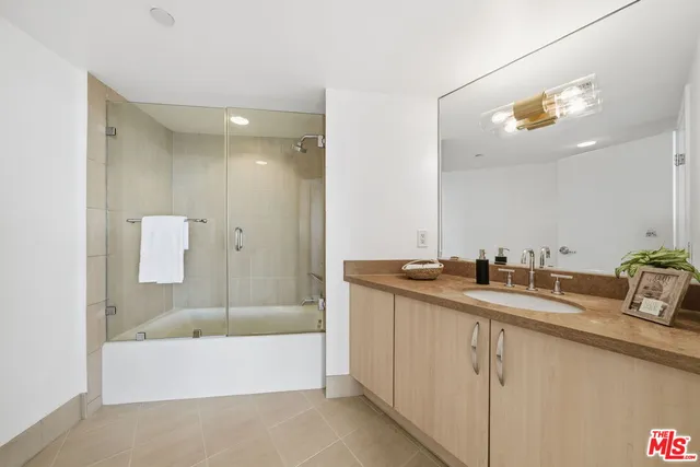 a spacious bathroom with a tub and shower