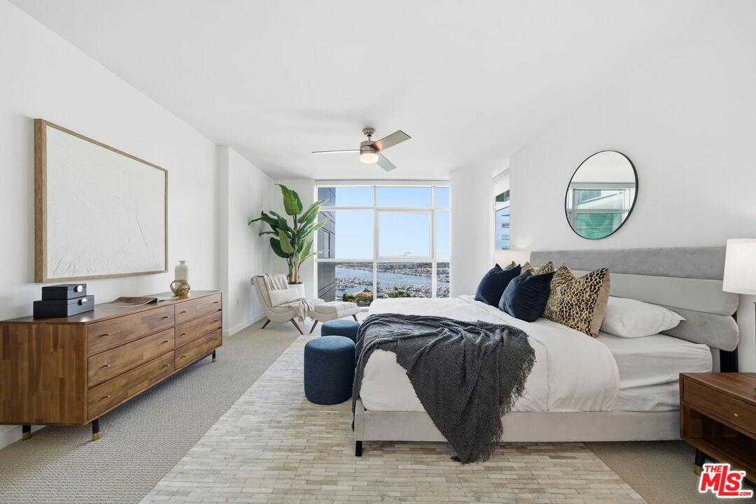 13650 Marina Pointe Drive, Unit 1603 Marina del Rey, CA 90292 - Photo 29 of 75 a bedroom with bed and a large window