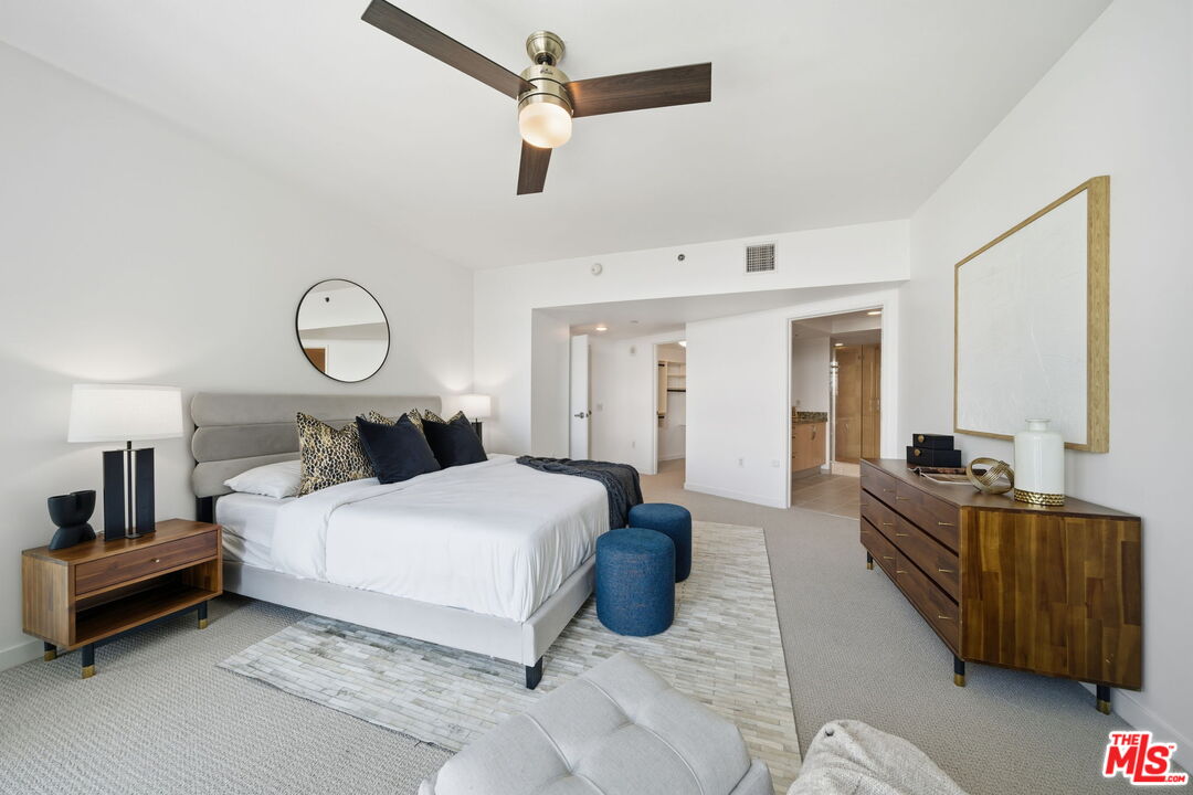 13650 Marina Pointe Drive, Unit 1603 Marina del Rey, CA 90292 - Photo 32 of 75 a bedroom with a bed and wooden floor