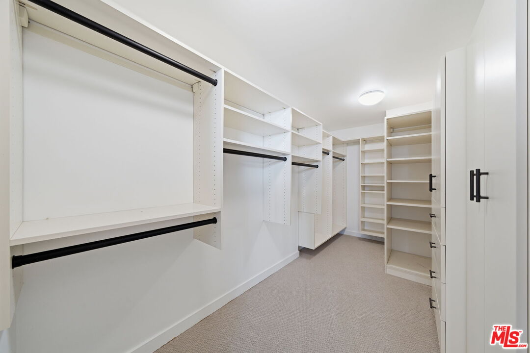 13650 Marina Pointe Drive, Unit 1603 Marina del Rey, CA 90292 - Photo 39 of 75 a view of walk in closet with empty racks