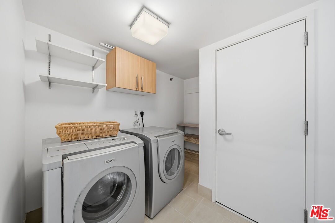 13650 Marina Pointe Drive, Unit 1603 Marina del Rey, CA 90292 - Photo 41 of 75 a utility room with dryer and washer