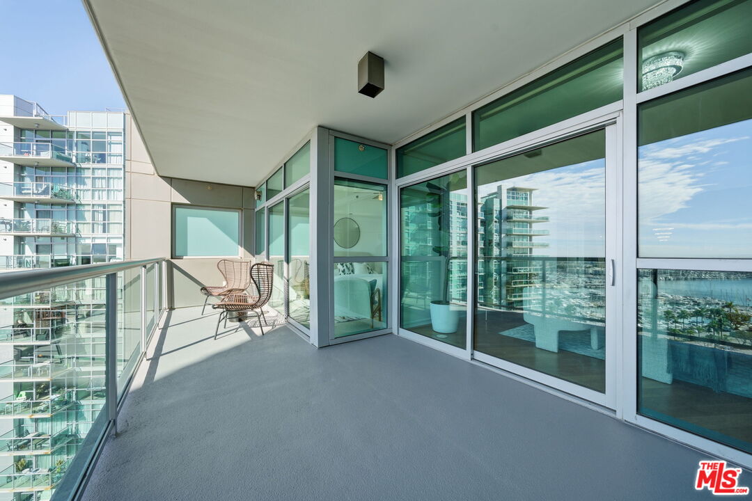 13650 Marina Pointe Drive, Unit 1603 Marina del Rey, CA 90292 - Photo 42 of 75 a view of a room with gym equipment and floor to ceiling window