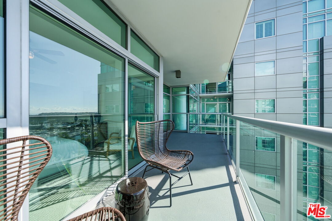 13650 Marina Pointe Drive, Unit 1603 Marina del Rey, CA 90292 - Photo 44 of 75 a view of a chair and table in the balcony