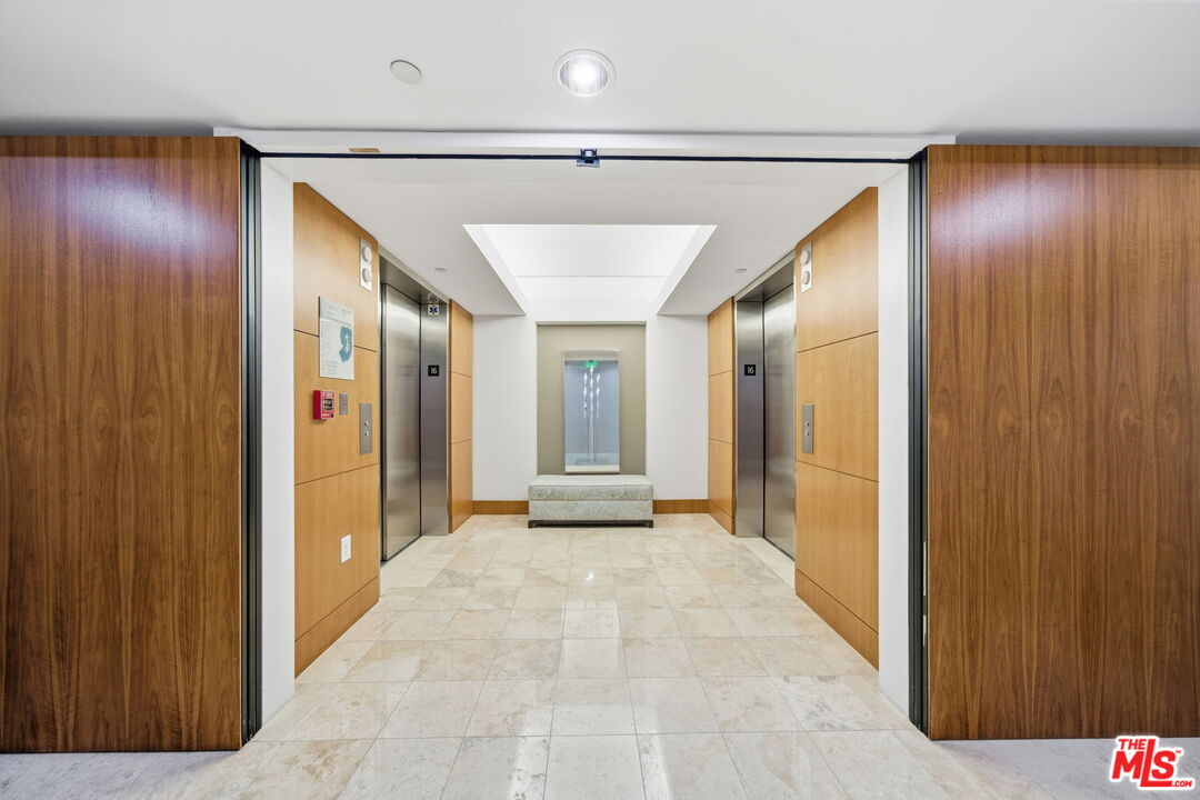 13650 Marina Pointe Drive, Unit 1603 Marina del Rey, CA 90292 - Photo 46 of 75 a view of a hallway with wooden shelves