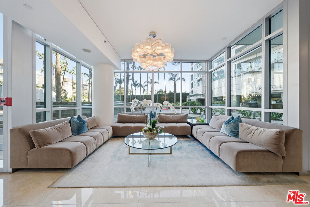 13650 Marina Pointe Drive, Unit 1603 Marina del Rey, CA 90292 - Photo 55 of 75 a living room with furniture and a large window