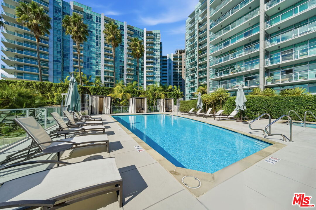 13650 Marina Pointe Drive, Unit 1603 Marina del Rey, CA 90292 - Photo 58 of 75 a view of a swimming pool with chairs