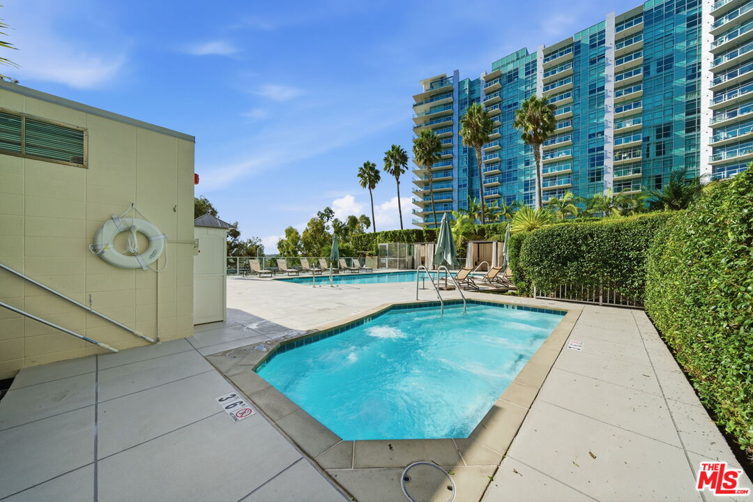 13650 Marina Pointe Drive, Unit 1603 Marina del Rey, CA 90292 - Photo 62 of 75 a view of swimming pool with outdoor seating and plants