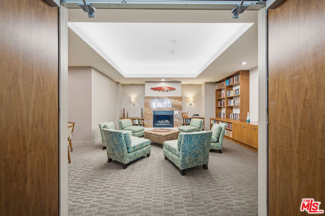 13650 Marina Pointe Drive, Unit 1603 Marina del Rey, CA 90292 - Photo 66 of 75 a living room with furniture and a fireplace