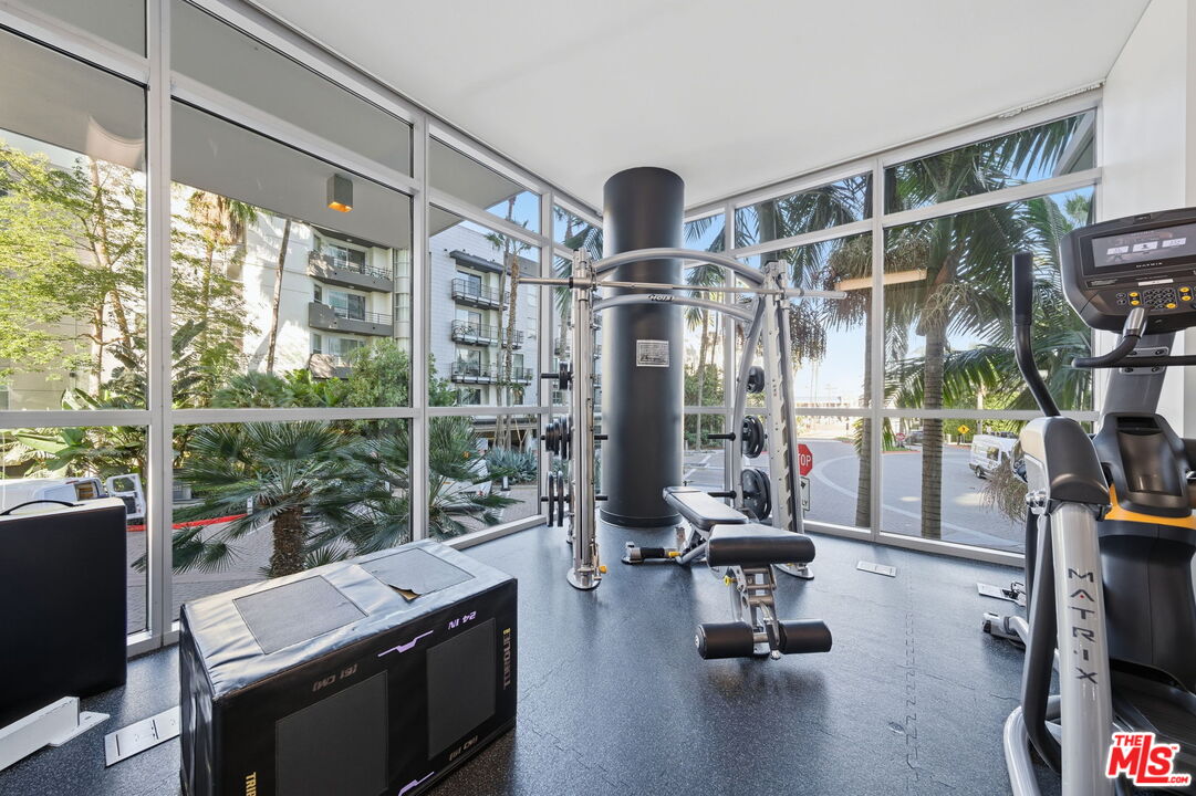 13650 Marina Pointe Drive, Unit 1603 Marina del Rey, CA 90292 - Photo 70 of 75 a view of a room with gym equipment