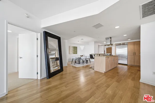 a kitchen with stainless steel appliances granite countertop a stove and a refrigerator