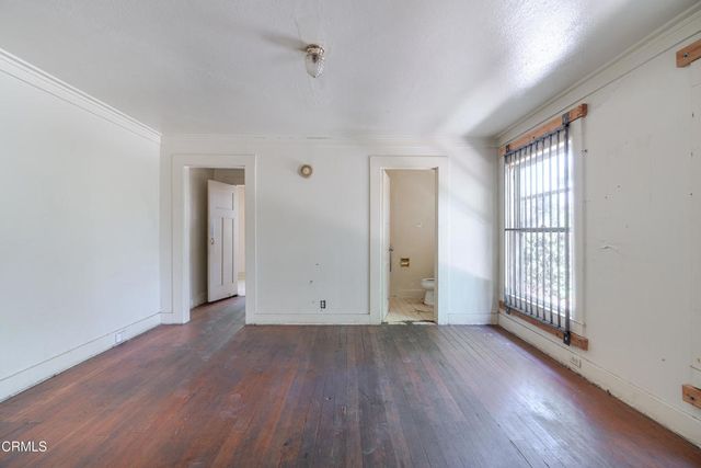 a bathroom with a sink mirror and toilet