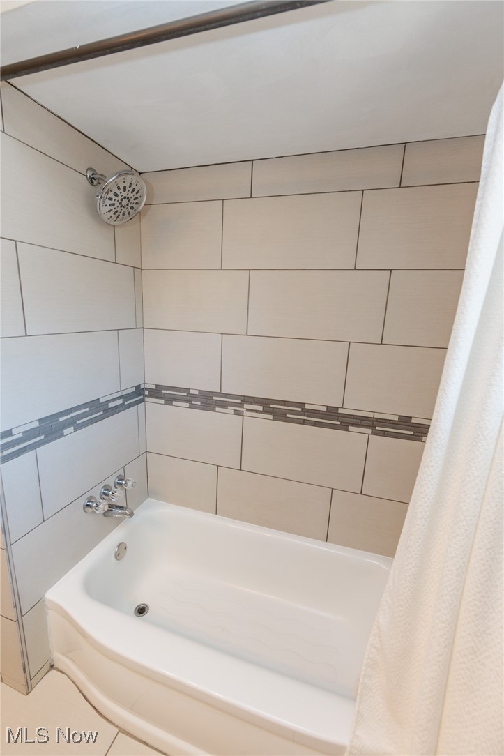 7316 Oakwood Road Parma, OH 44130 - Photo 18 of 41 Bathroom featuring shower / bath combo and tile patterned floors