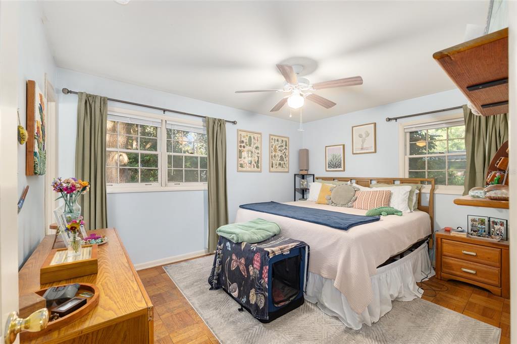 3018 Northwest 2nd Avenue Gainesville, FL 32607 - Photo 11 of 21 a bedroom with a bed and wooden floor