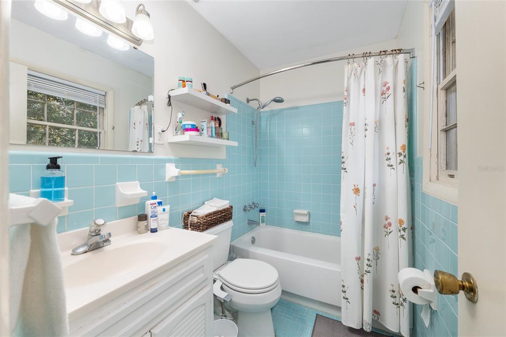 3018 Northwest 2nd Avenue Gainesville, FL 32607 - Photo 12 of 21 a bathroom with a sink toilet tub and shower