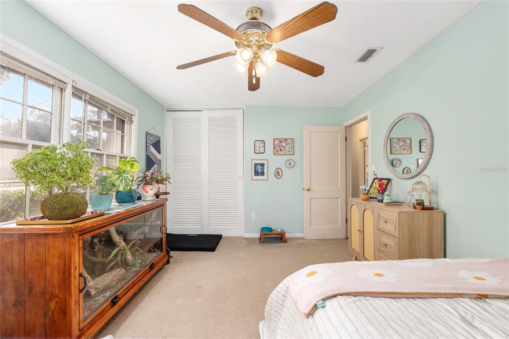 3018 Northwest 2nd Avenue Gainesville, FL 32607 - Photo 13 of 21 a bedroom with furniture and a window
