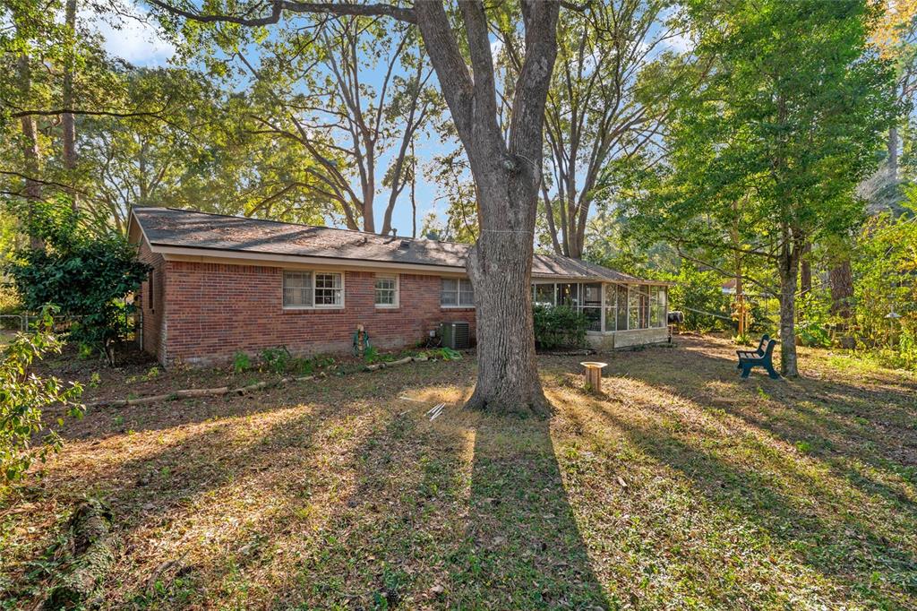 3018 Northwest 2nd Avenue Gainesville, FL 32607 - Photo 18 of 21 a view of a house with a yard