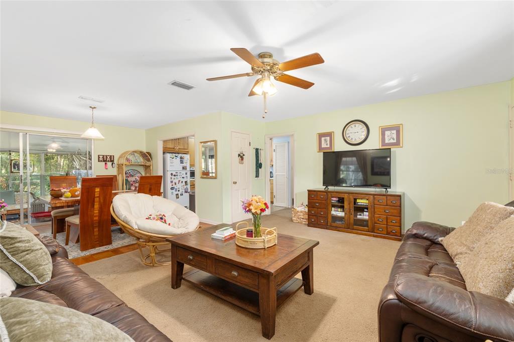3018 Northwest 2nd Avenue Gainesville, FL 32607 - Photo 6 of 21 a living room with furniture a clock on wall and a window