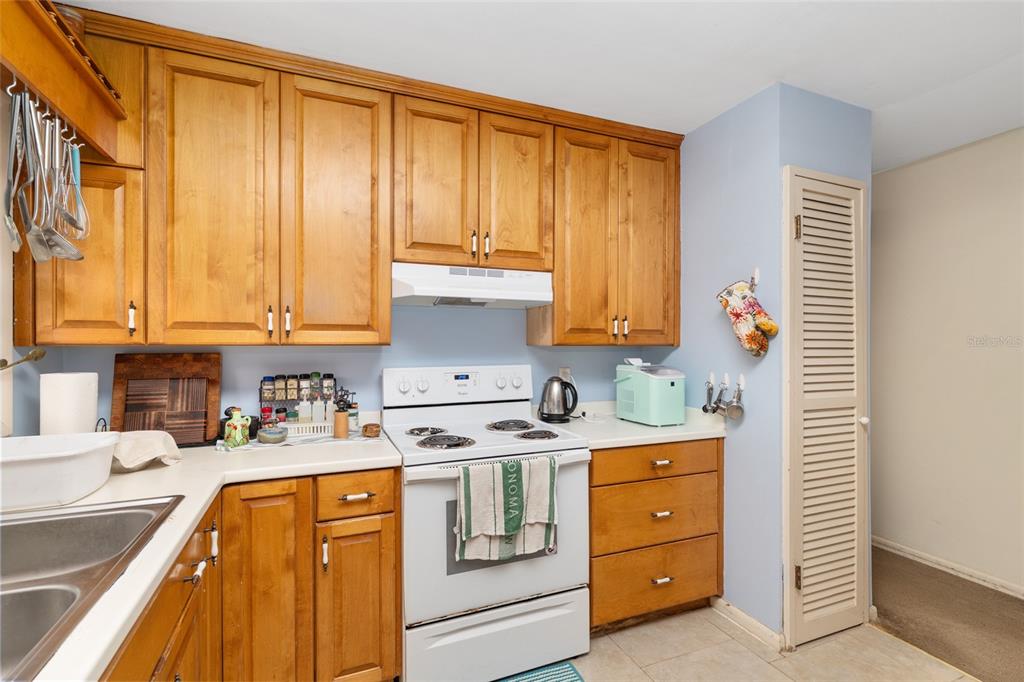 3018 Northwest 2nd Avenue Gainesville, FL 32607 - Photo 10 of 21 a kitchen with stainless steel appliances granite countertop a sink stove and cabinets