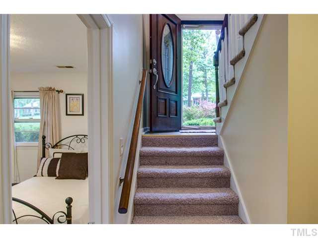 5822 Scalybark Road Durham, NC 27712 - Photo 19 of 25 The stairs lead to the lower level, where there are two additional bedrooms, a full bathroom, a huge family room, and a large utility room where the washer/dryer are located. Staircase