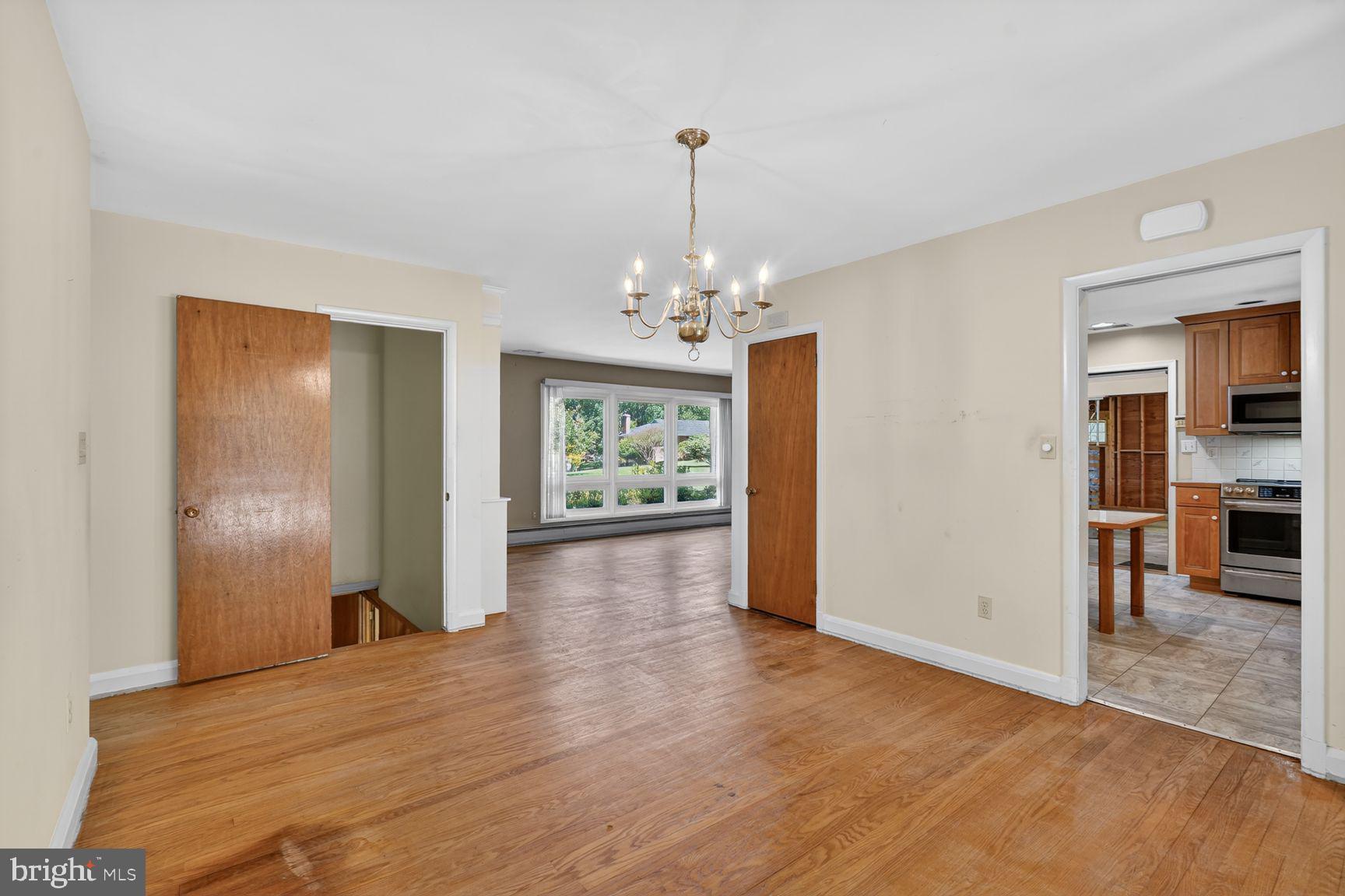3029 Ramblewood Road Ellicott City, MD 21042 - Photo 8 of 21 Pocket doors in dining room open to flexible room