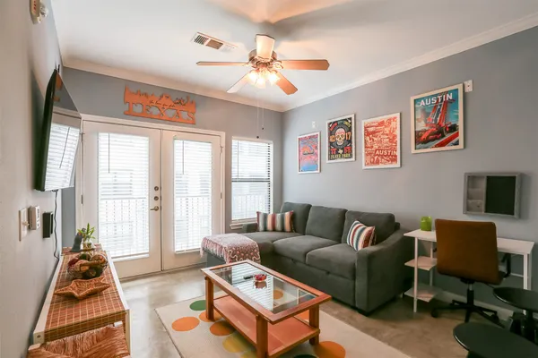 a living room with furniture and a flat screen tv