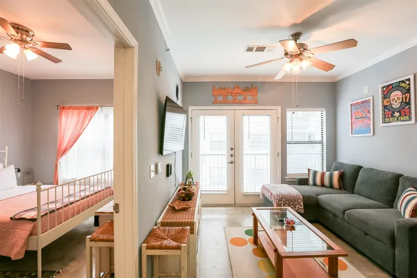 a living room with furniture and a large window