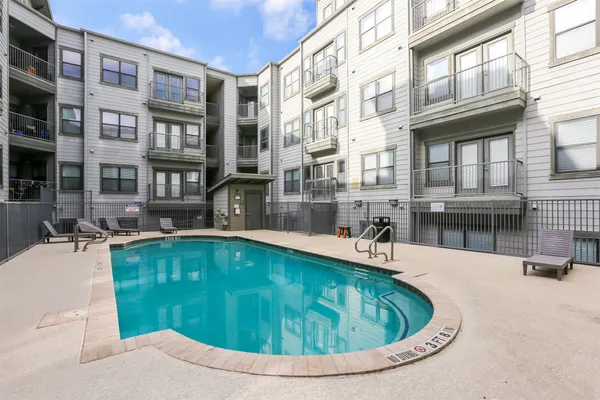 a view of parking garage with cars
